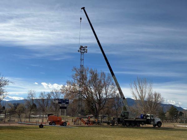 Crane removing old light tower at Rouse Park