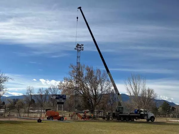 Crane removing old light tower at Rouse Park