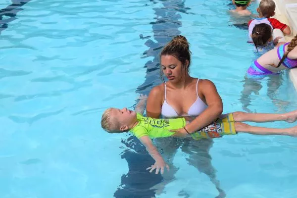 Young swimmer learning to float